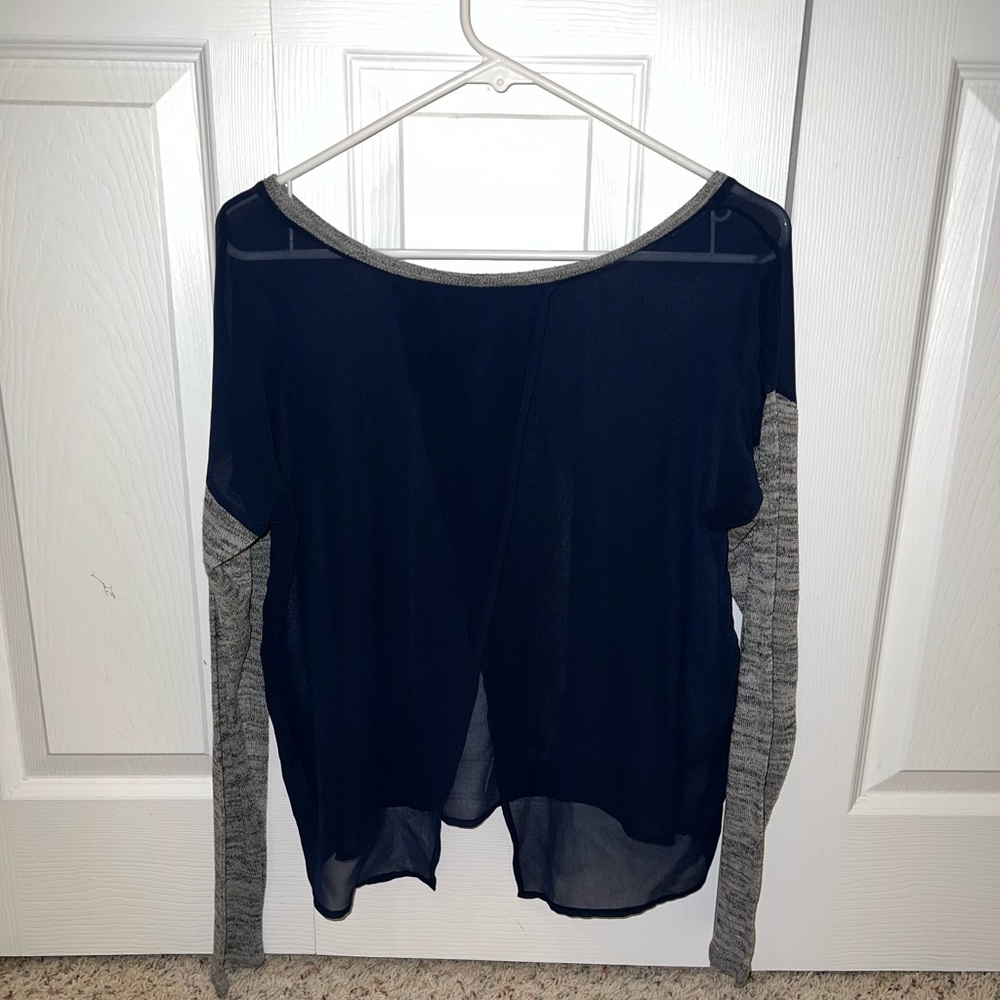 See through top with cloth sleeves.